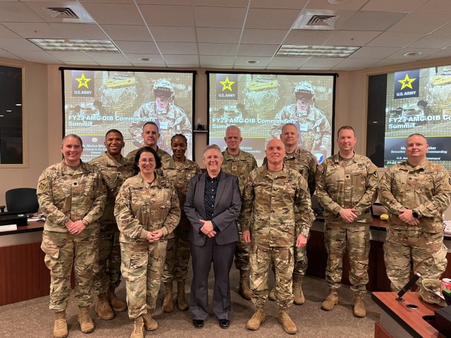 Marion Whicker, Army Materiel Command executive deputy to the commanding general, takes a photo with the Organic Industrial Base that attended their final OIB Summit as an OIB commander.