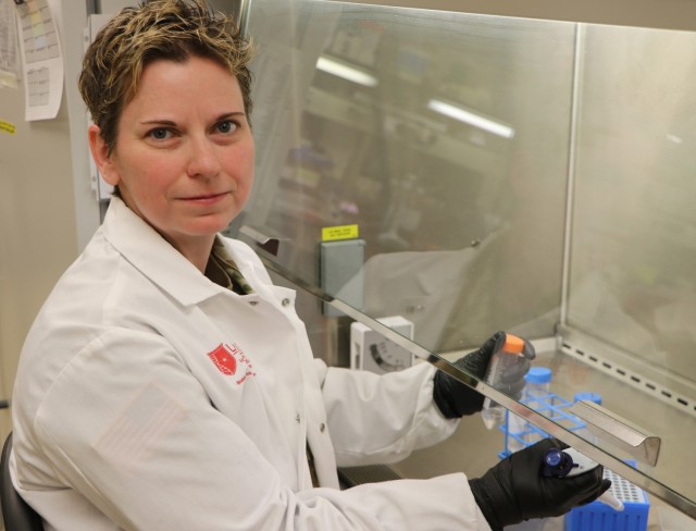 Capt. Sara Johnston works in a laboratory at U.S. Army Medical Research Institute of Infectious Diseases, Fort Detrick, Md.