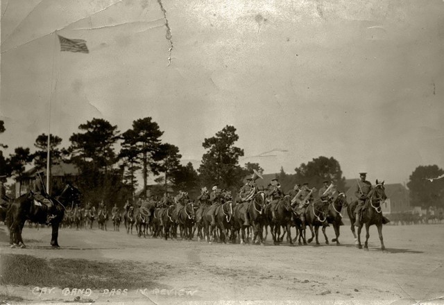 The mounted band of the 11th U.S. Cavalry Regiment passes in review on the parade ground at the Presidio of Monterey, Calif., 1925.