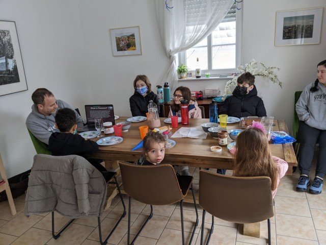Rick Beigler leads a group of children during a Chocolate Seder event March 26 at USAG Rheinland-Pfalz. The group joined children in Vilseck and Muenster, Germany, with others in France and Japan via Teams as a part of the Jewish Religious Education Program.