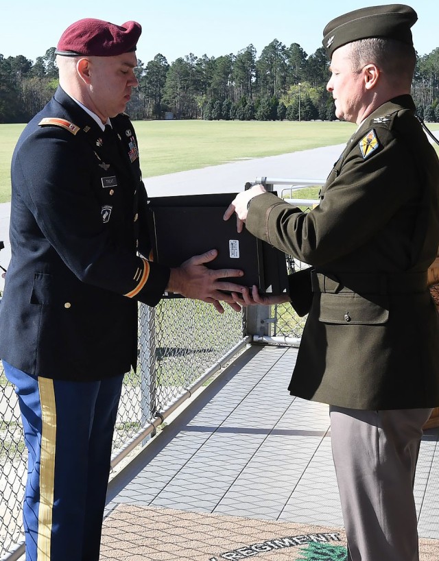 Chief Warrant Officer 2 Ryan Treat receives his Retiree Commendation Package from Col. Price during the Retirement Review Ceremony as part of 2nd Battalion, 13th Infantry Regiment’s Basic Combat Training graduation, March 9.