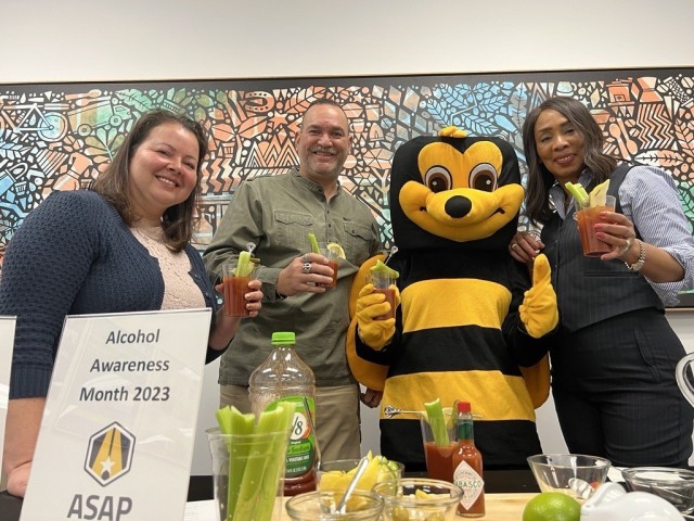 (From left to right) Army Substance Abuse Prevention Coordinator Katrina Kilmartin-Baucom, Fort Bragg/Pope AFB/Seymour Johnson AFB Exchange Assistant Loss Prevention Manager Armando Majia-Alonso, the Exchange’s official mascot “Buzz the Safety Bee” and ASAP Risk Reduction Program Coordinator Stephanie Williams-Glover, give a toast to Alcohol Awareness Month and remind everyone to be safe, March 16. As part of Alcohol Awareness Month, ASAP encourages everyone to choose a three-day alcohol-free weekend during the month of April. (U.S. Army photo by Jacqueline Hill, Fort Bragg Garrison Public Affairs)