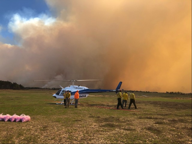 Fort Stewart and Fort Gordon Forestry personnel observe a smoke plume following a controlled helicopter burn on Fort Gordon’s Artillery Impact Area, March 8. Fort Gordon requested assistance from the Fort Stewart Forestry Branch following a 2021 wildfire that was started in their AIA.