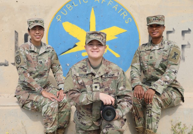 Meet the team. U.S. Army Reserve public affairs officers, Capt. Katherine Alegado and Capt. Janeen Phelps, 143d Expeditionary Sustainment Command, pose with U.S. Army Spc. Cecilia Soriano, visual information specialist, 1st Theater Sustainment Command, in honor of Women's History Month. (U.S. Army photo by Spc. Rhema Eggleston)