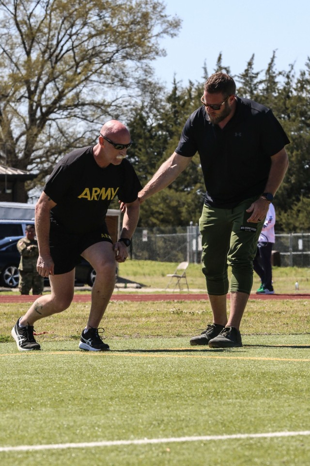 U.S. Army Staff Sgt. Robert Ellison and Coach Tyler Spencer, practice running form during the U.S. Army Adaptive Sports Camp at Fort Bragg, North Carolina, March 30, 2023. Over 70 wounded, ill and injured Soldiers are training in a series of athletic events including archery, cycling, shooting, sitting volleyball, swimming, powerlifting, track, field, rowing, and wheelchair basketball. The Adaptive Sports Camp celebrates wounded, ill, and injured Soldiers ability to recover and overcome. The Army Holds qualifying trials for Active Duty, wounded, ill, or injured Soldiers to assess and select athletes for competition in the DoD Warrior Games Challenge. This year, the DoD Warrior Games Challenge takes place in June 2023 at Naval Air Station North Island in San Diego, California.
(U.S. Army photo by Cpl. Anthony Hopper.)
