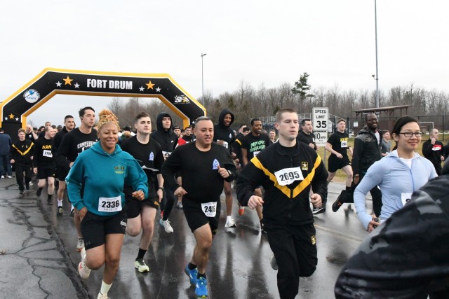 More than 750 Fort Drum community members participated in the inaugural Mountain Wellness 5K Run on April 6 outside Magrath Sports Complex. Representatives from the Fort Drum Soldier and Family Readiness Division teamed with Family and Morale, Welfare and Recreation to host the run in support of Mountain Wellness Month. The annual awareness campaign in April covers Child Abuse Prevention Month, Alcohol Awareness Month, Financial Literacy Month, Autism Awareness Month, and Sexual Assault Awareness and Prevention Month. (Photo by Mike Strasser, Fort Drum Garrison Public Affairs)