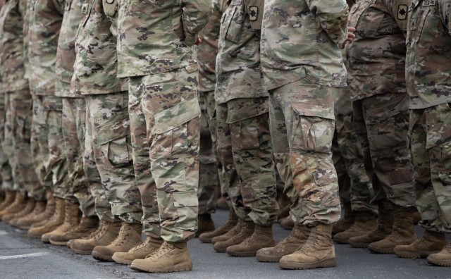 NORTH LITTLE ROCK, Ark. — Guardsmen stand at parade rest during a portion of the 30-minute departure ceremony before spending a few last minutes with loved ones. More than 160 Guardsmen from the 39th Infantry Brigade Combat Team headquarters...