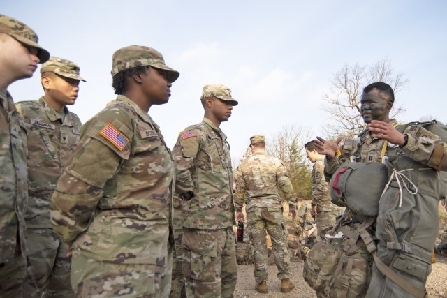 Capt. Gabriel Abreu, with the 37th Brigade Engineer Battalion, at Fort Bragg, North Carolina, speaks with Soldiers from Company B, 84th Chemical Battalion, on Army Airborne opportunities Tuesday morning near Forney Airfield during the Operation...
