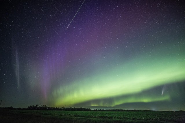 The aurora borealis flows undulatingly with its brilliant colors across the night sky, as a distortion emerges that disrupts the precision of global navigation satellite systems (GNSS).