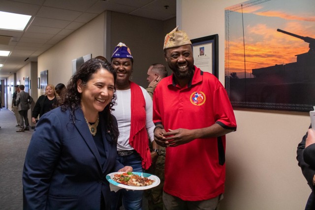 Administrator Isabella Casilla Guzman, U.S. Small Business Administration, laughs with Tracey Brown Green, state of Texas Military Order of the Purple Heart commander, and Willie Keller, CSM A.C Cotton, VFW Post 12209, commander, during lunch...