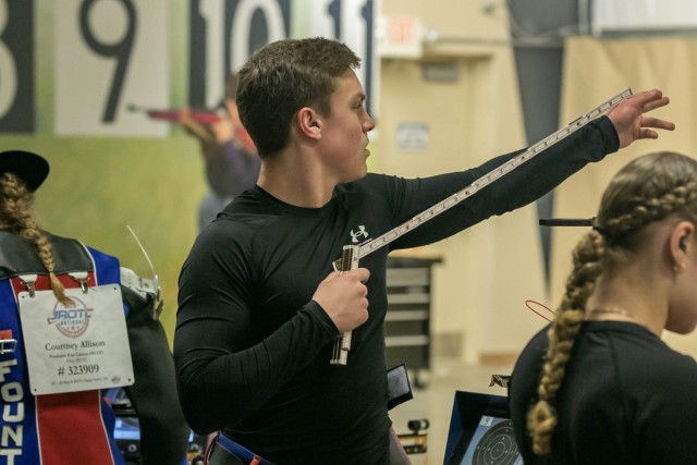 Caden Cavanaugh, an Army JROTC Cadet from Fountain-Fort Carson High School, uses a measuring tool to help establish his stance during the 2023 JROTC National Air Rifle Championship on March 25 at Camp Perry, Ohio. The competition is held March 23-25 and features the best marksmen from all-service JROTC programs across the country competing in sporter and precision shooting events. | Photo by Sarah Windmueller, U.S. Army Cadet Command Public Affairs