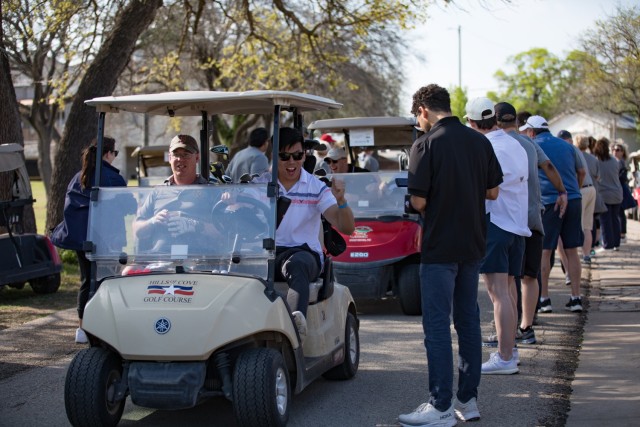 Golfers excitedly drive off into the Courses of Clear Creek to begin the Ben Hogan Classic March 31 at Fort Hood, Texas. (U.S. Army photo by Blair Dupre, Fort Hood Public Affairs)
