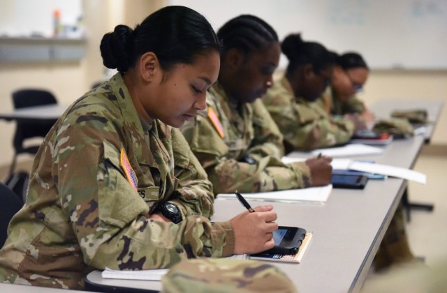 Recruits in the Academic Skills Development Program at Fort Benning, Georgia, study during the self-paced section of the course, March 31. The students work for three weeks to improve their arithmetic reasoning, word knowledge, paragraph comprehension and mathematics.  