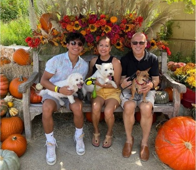 Rand Rodriguez, right, with his son Brandon, wife Patricia and family dogs Wizer, Winny and Sofia. 