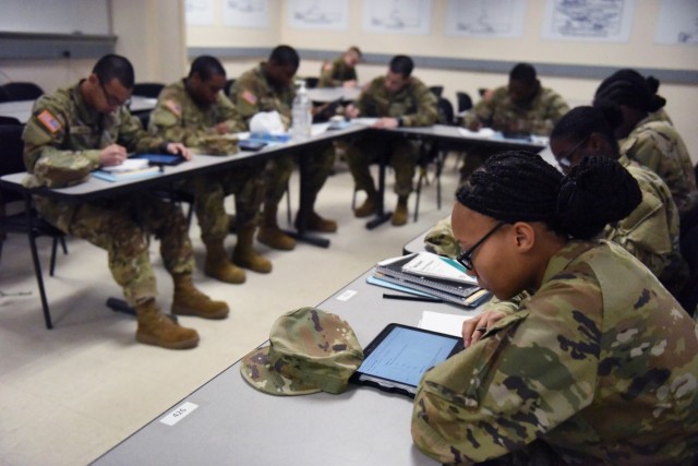 Recruits in the Academic Skills Development Program at Fort Benning, Georgia, study during the self-paced section of the course, March 31. The students work for three weeks to improve their arithmetic reasoning, word knowledge, paragraph comprehension and mathematics.