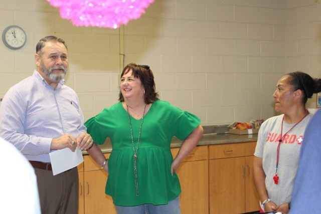 From left are IMCOM-Sustainment Director Davis Tindoll; Gaylene Wilson, chief of community recreation; and Stephanie Brown, lead lifeguard at the Aquatics Center. 