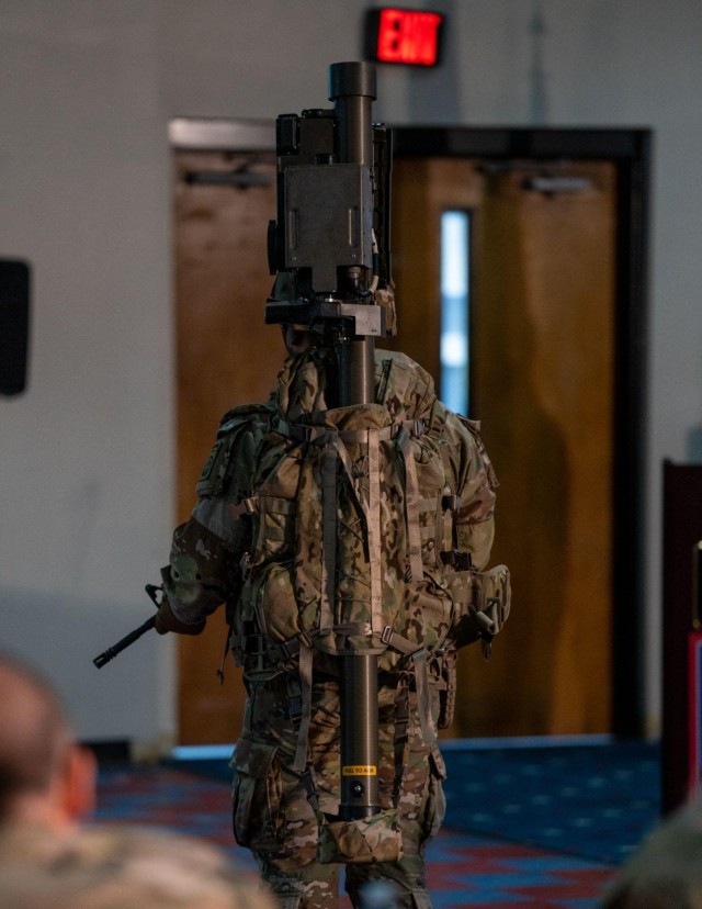 A Paratrooper displays a prototype missile carry pack for a board of judges during the 82nd Airborne Division Innovation’s first Innovation Drop Zone Competition on Fort Bragg, N.C., March 29, 2023. Presented by 1st Lt. Dillon To, the missile carry pack is a universal carrying system primarily designed for the Javelin and Stinger weapon systems. 