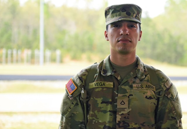 Pfc. Adam Vega poses for a photo after completing the Academic Skills Development Program at For Benning, Georgia, March 31. Vega improved his scores during the three-week course from 38 to 72, allowing him to renegotiate his contract to become a combat medic. 