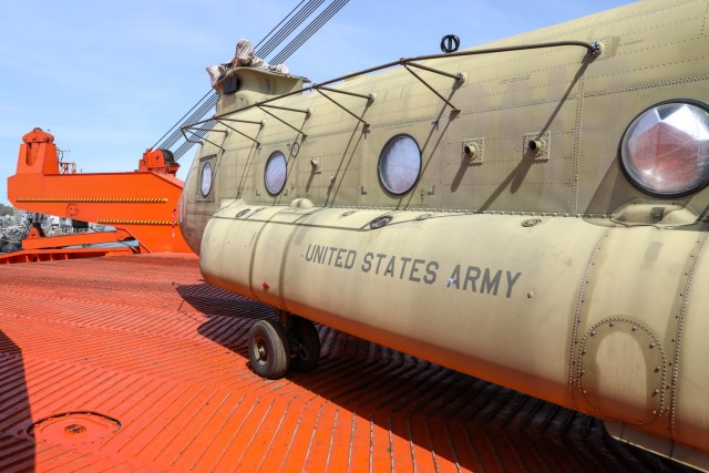 A CH-47 Chinook is offloaded from a vessel by U.S. Army 5th Battalion, 159th Aviation Regiment, 244th Expeditionary Combat Aviation Brigade with support from Naval Supply Systems Command Fleet Logistics Center - Rota for Defender 23 at Naval Station Rota, Spain on April 6, 2023.