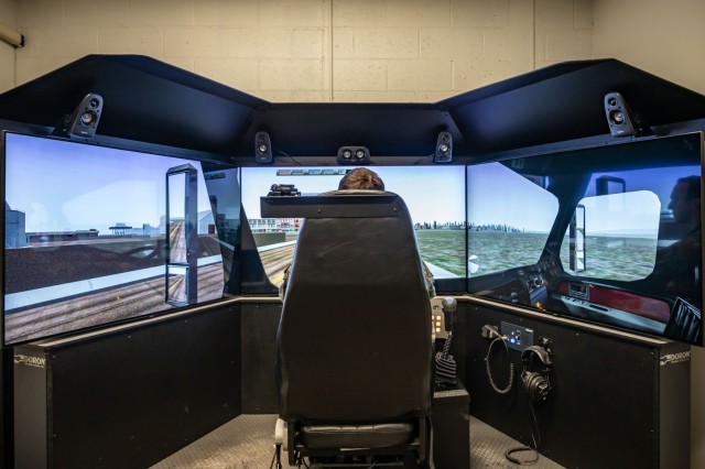 U.S Air Force Staff Sgt. Corey Beecher, assigned to the 103rd Logistics Readiness Squadron, uses a driving simulator April 4, 2023, at Bradley Air National Guard Base, Connecticut. The simulator is used to practice driving skills in various scenarios and military vehicles. (U.S. Air National Guard photo by Airman Emme Drummond) 