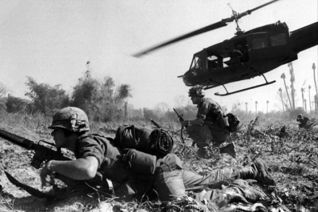 Army Maj. Bruce Crandall’s UH-1D Iroquois helicopter climbs skyward after discharging a load of infantrymen in Vietnam. Army photo