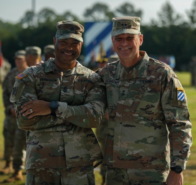Maj. Gen. Charles Costanza, the commanding general for the 3rd Infantry Division, and Command Sgt. Maj. Quentin Fenderson, the outgoing senior enlisted advisor for 3rd ID, pose for a photo during a change of responsibility ceremony at Cottrell Field on Fort Stewart, Georgia, April 6, 2023. Throughout Fenderson’s 29-year military career, he has served at nearly every enlisted leadership position with the Marne Division. Serving as the division’s senior enlisted advisor is his final assignment as he prepares for retirement with his wife, Olivia, and their children. (U.S. Army photo by Pfc. Bernabe Lopez III, 50th Public Affairs Detachment)