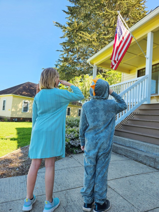 Lillian and Lucas Beavers, military children, salute the flag at the Presidio of Monterey, Calif., April 9. They are the children of Air Force Master Sgt. Kevin Beavers.