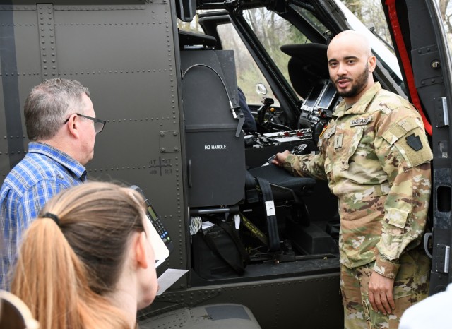 U.S. Army Warrant Officer Dejour Hughes, a UH-60 Black Hawk helicopter pilot with the 28th Expeditionary Combat Aviation Brigade, demonstrates cockpit instruments to first responders at the Covington Independent Fire Company, Covington,...