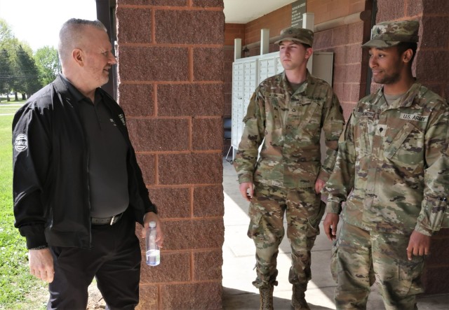 John Troxell speaks with Soldiers outside a Fort Knox barracks during a visit to the installation April 19, 2023.