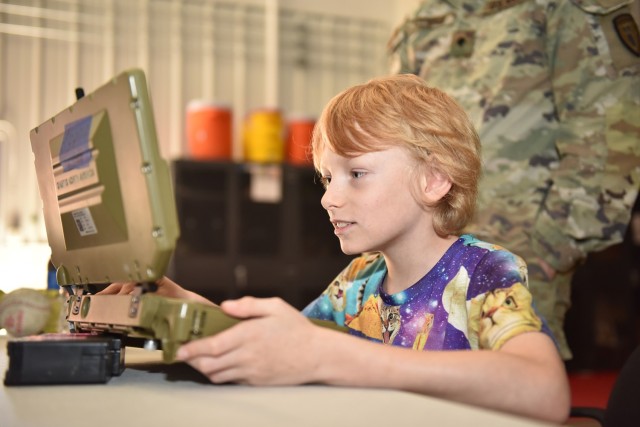 Bentley Holcomb, a third-grade member of Wood Elementary School’s Robotics Club, practices controlling a Common Robotics System – Individual robot during a field trip on Friday to Fort Leonard Wood’s 763rd Ordnance Company.