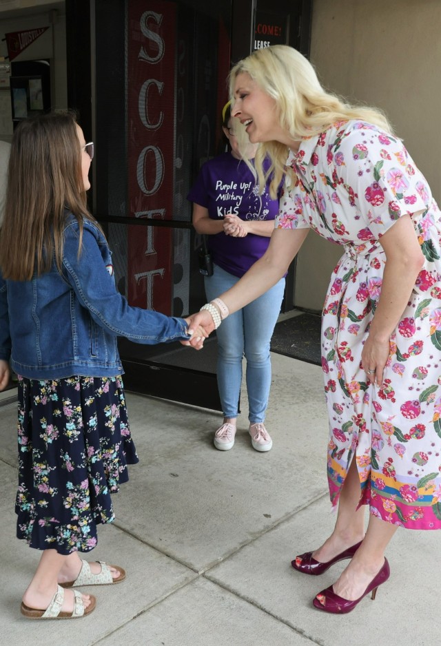 Kentucky First Lady Britainy Beshear shakes hands with a Scott Intermediate School student on Purple Up Day April 21, 2023 to celebrate the Month of the Military Child.