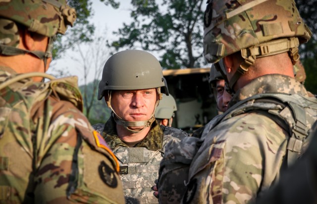 Lt. Gen. Bashkim Jashari, commander of the Kosovo Security Force, is briefed on unit operations by the commander of the 1st Battalion, 133rd Infantry Regiment, Iowa Army National Guard, during a tour of training at Camp Atterbury, Indiana, May 19, 2022. Approximately 15 KSF troops embedded with companies in the 1-133rd Infantry during a two-week annual training exercise. (U.S. Army National Guard photo by Staff Sgt. Tawny Schmit)
