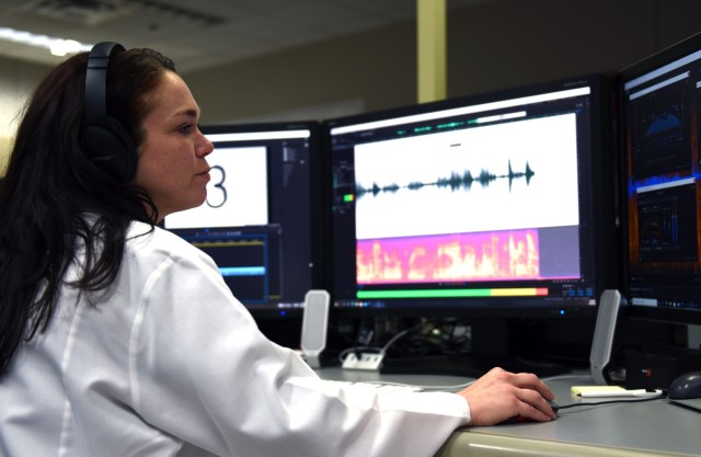 Christina Malone, USACIL digital forensic examiner, performs an audio/video analysis demonstration during a laboratory visit March 28 in Forest Park, Georgia. The lab provides criminal investigators from every military branch with 24 forensic services ranging from DNA testing to latent print and trace evidence analysis.  
