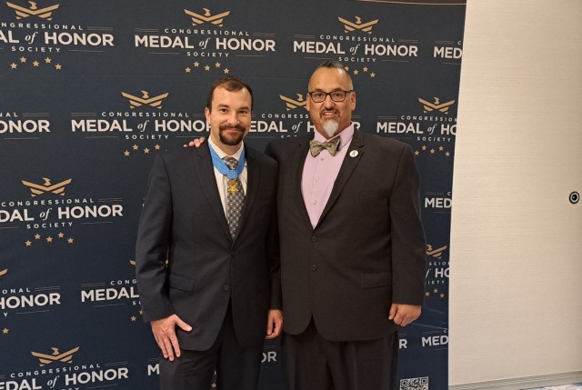 Retired Army Maj. Richard Fierro, right, poses with Medal of Honor recipient retired Staff Sgt. Salvatore Giunta during the Congressional Medal of Honor Society awards banquet on National Medal of Honor Day March 25, 2023. 