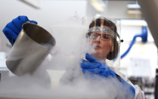 Kim Westberry, USACIL chemist, performs a  demonstration during a laboratory visit March 28 in Forest Park, Georgia. The lab provides criminal investigators from every military branch with 24 forensic services ranging from DNA testing to latent print and trace evidence analysis.  