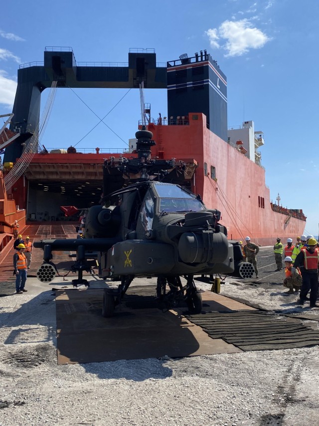 Soldiers assigned to the 3rd Combat Aviation Brigade, 3rd Infantry Division, unload an AH-64E Apache in the port of Thessaloniki, Greece, April 12, 2023. 3rd CAB is supporting Atlantic Resolve, a nine-month rotation that provides rotational deployments of combat-credible forces to Europe to show our commitment to NATO while building readiness, increasing interoperability, and enhancing the bonds between Ally partner militaries. (U.S. Army photo by Maj. Ross Skilling)
