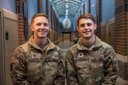 Staff Sgt. Ethan Estabrooks, left, and brother Spc. Gavin Estabrooks, smile for a photo after competing in the 2023 Iowa Army Best Warrior Competition. The Estabrooks brothers serve together as federal technicians at the Army Aviation Support Facility in Boone, Iowa, as UH-60 Black Hawk mechanics.