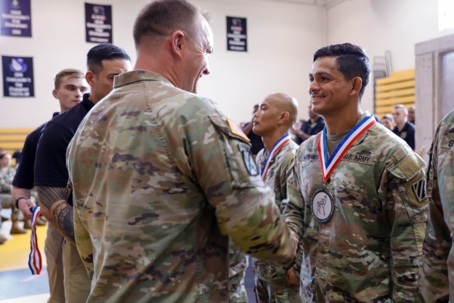Spc. Duke Edwards, a public affairs mass communication specialist, assigned to 50 Public Affairs Detachment, 3rd Infantry Division, Fort Stewart, Georgia, places second in the Lacerda Cup, an all Army combatives championship tournament, at Sgt. 1st Class. Paul R. Smith Gym, Fort Benning, Georgia, April 13. 2023. Competitors across the Army will compete in the Lacerda Cup All-Army Combatives Championship April 10-13.The event promotes esprit de corps, exchanges best practices within the combatives community, assesses the effectiveness of the Combatives Programs of Instruction, evaluates Army readiness, and showcases the MCOE. (U.S. Army photo by Pfc. Summer Parish/ 50 Public Affairs Detachment)
