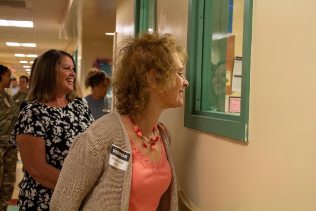 McConville peeks inside a CDC classroom.