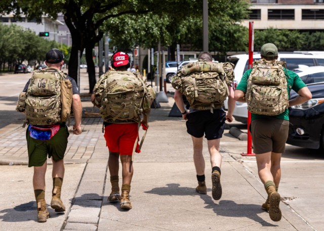 1st Cavalry Division Sustainment Brigade Troopers, ruck to Minute Maid Park, honoring MLB legend Jackie Robinson in Houston, TX, April 16. The ruck march, saw members of the “Wagonmasters” carrying a rucksack weighing 42 pounds in honor of Robinson&#39;s number. The event tested the participants&#39; endurance, strength, and resilience while symbolizing the importance of teamwork and support in achieving shared goals. (Photo by U.S. Army Spc. Cheyne Hanoski)