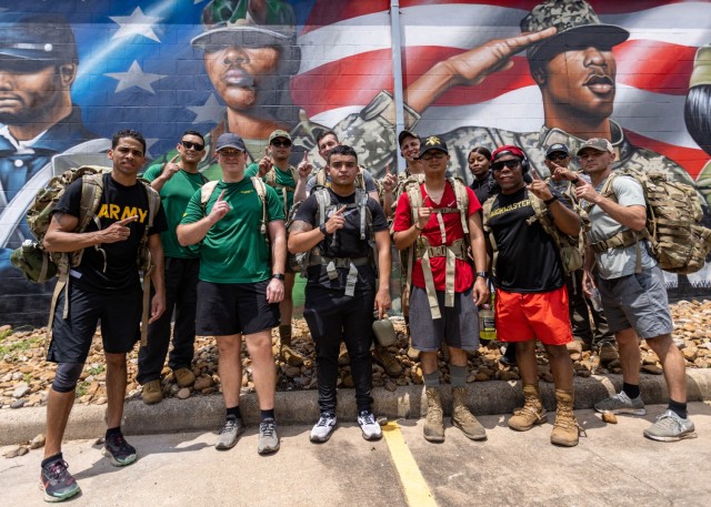 1st Cavalry Division Sustainment Brigade Troopers, show their unit pride while ruck marching in honor of MLB legend Jackie Robinson in Houston, TX, April 16. The ruck march, saw members of the “Wagonmasters” carrying a rucksack weighing 42 pounds in honor of Robinson&#39;s number. The event tested the participants&#39; endurance, strength, and resilience while symbolizing the importance of teamwork and support in achieving shared goals. (Photo by U.S. Army Spc. Cheyne Hanoski)