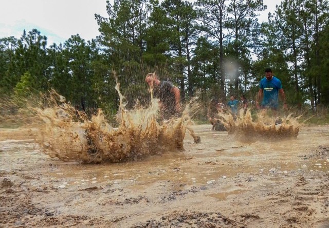 Elated runners take on a 4-mile trail of muck