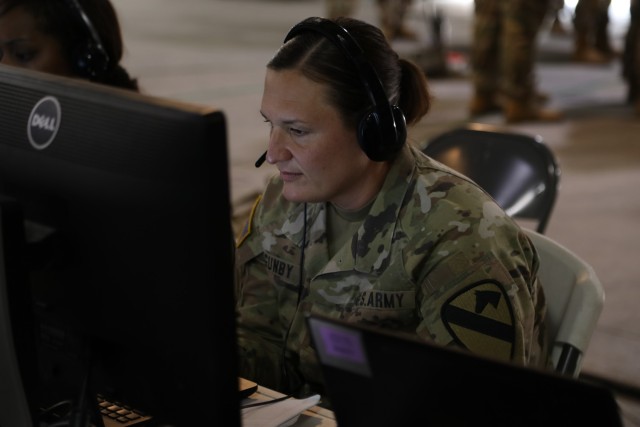 Master Sgt. Laura Gunby, 1st Cavalry Division Medical Operations noncommissioned officer, tracks and coordinates for medical support during the Warfighter 23-04 exercise. During this exercise, 1CD fully integrated all Mission Command Integration Systems including the Command Post Computing Environment (CPCE) to synchronize units across the Division battlespace.