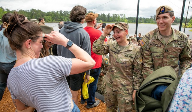 1st Lt. Anna Zaccaria, 100th Battalion, 442nd Infantry, (center) and her best friend Katie Sepkovich (left) react to each other in celebration after Zaccaria’s Army Ranger School graduation ceremony at Fort Benning, GA, April 28, 2023.
