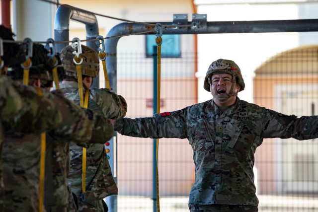 Warrant Officer Juan P. Renteria, assigned to Brigade Support Battalion, 173rd Airborne Brigade, calls commands during sustained airborne training Jan. 26, 2023, at Aviano Air Base, Italy. 