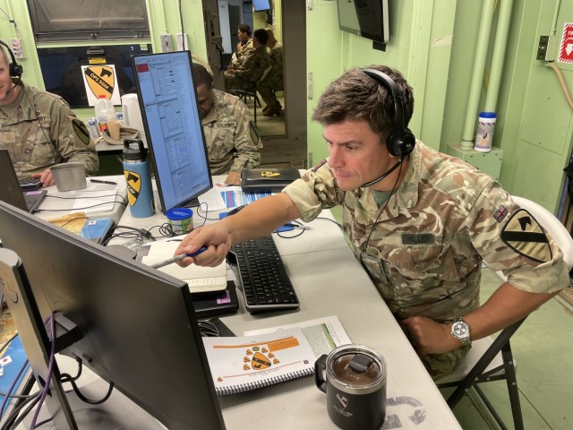 Maj. Huw Miller, 1st Cavalry Division current operations officer from the 3 (United Kingdom) Division, tracks and synchronizes current operations on the battlefield during the Warfighter 23-04 exercise. During this exercise, 1CD fully integrated all Mission Command Integration Systems including the Command Post Computing Environment (CPCE) to synchronize units across the Division battlespace.