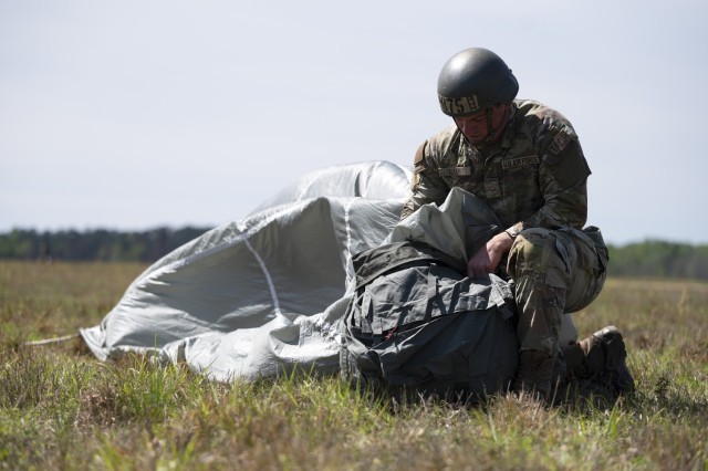 An airborne student packs his parachute after completing a jump during the Basic Airborne Course at Fort Benning, Georgia, March 29. The three-week course teaches service members from every military branch how to safely conduct airborne operations.