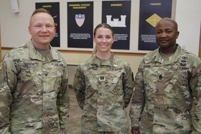 Pictured from left to right are Reynolds Army Health Clinic Commander Col. Daniel Bridon, Capt. Courtney Livoti, and Reynolds Army Health Clinic Command Sgt. Maj. Stanley Jackson at the Expert Field Medical Badge badging ceremony. 