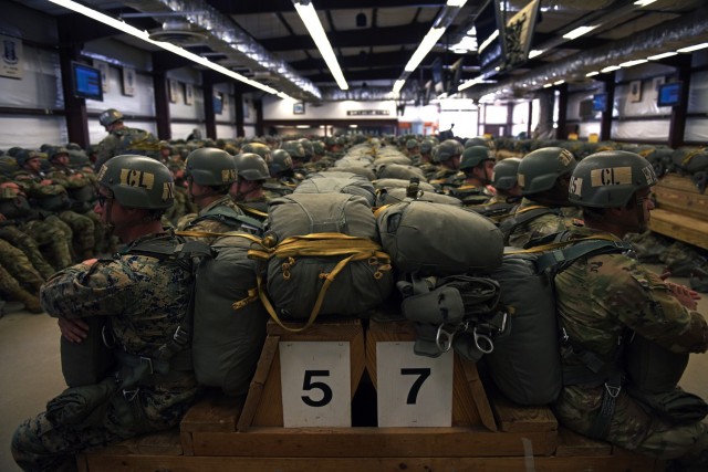 Airborne students wait to board a C-130 cargo aircraft as they prepare to make their second jump during the Basic Airborne Course at Fort Benning, Georgia, March 29. The three-week course teaches service members from every military branch how to safely conduct airborne operations. 