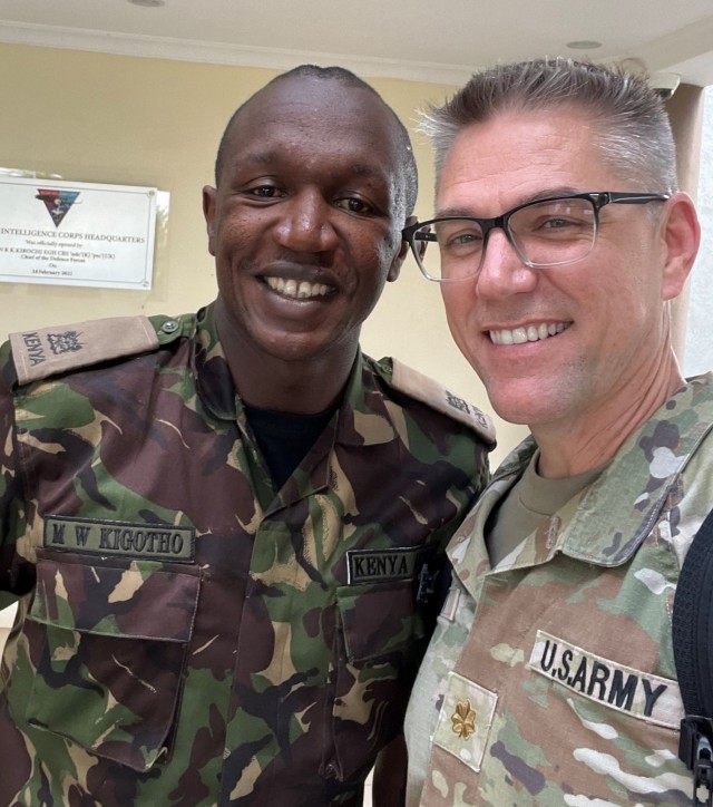 Maj. Joe Huitt of Army Cyber Command's Joint Force Headquarters-Cyber (Army) poses for a photo with Maj. M.W. Kigotho of the Kenya Defense Forces, during the Kenyan Cyber Workshop, at the Kenyan Military Intelligence Corps Headquarters in Nairobi, Kenya. The workshop, conducted April 24-26, 2023, was U.S. Africa Command's first such event with Kenyan forces. (Courtesy photo)